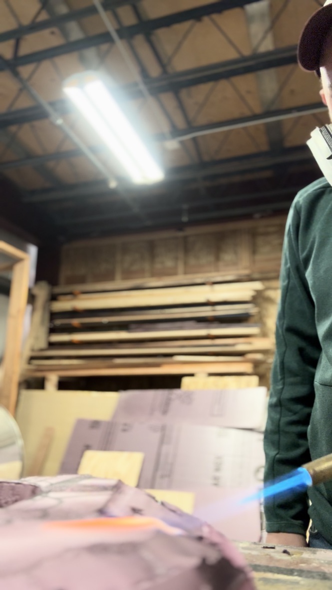 Brandon PT Davis shaping scenery in the shop